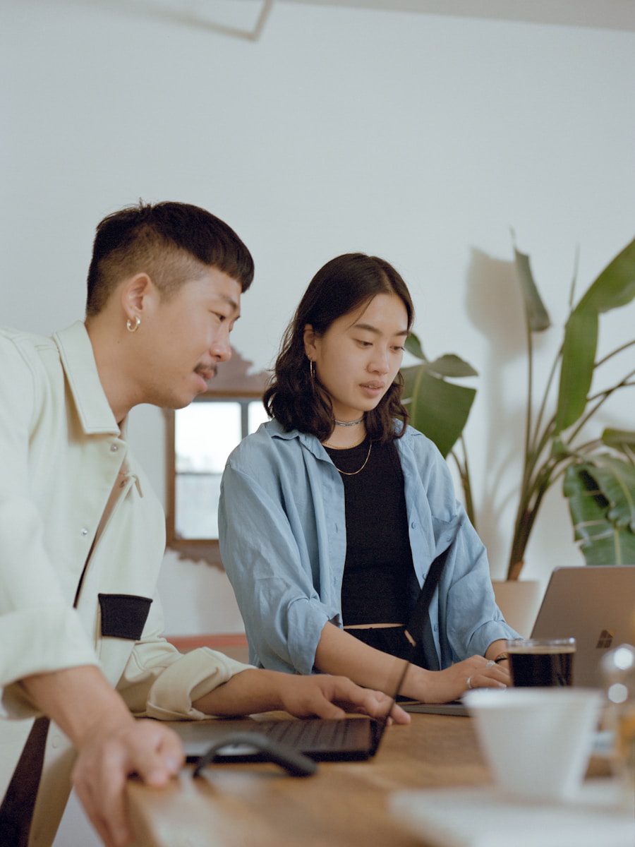 Photo by Surface man and woman sitting at table